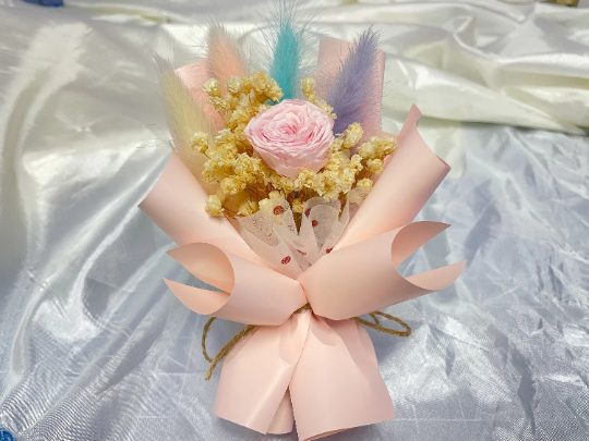 Car Decoration Dried Flower Bouquet with pink rose in the center.